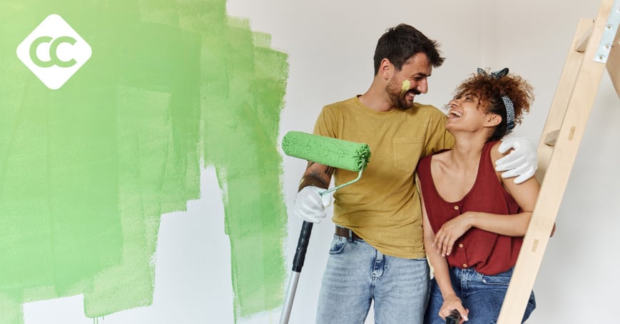 Couple painting their house green